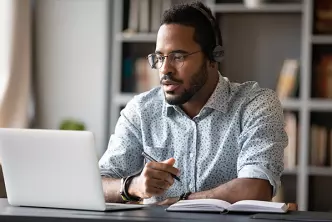 black guy looking at computer